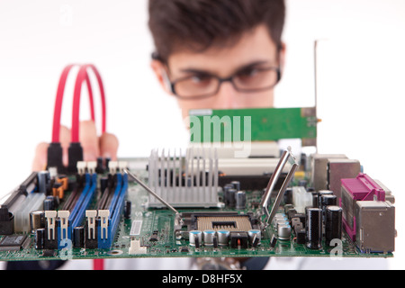 Computer Engineer Motherboard Computer engineer working on an old motherboard Stock Photo - Alamy