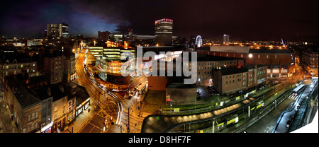 Manchester , UK dusk night panorama looking from Shude Hill towards market street and Piccadilly Gardens Stock Photo