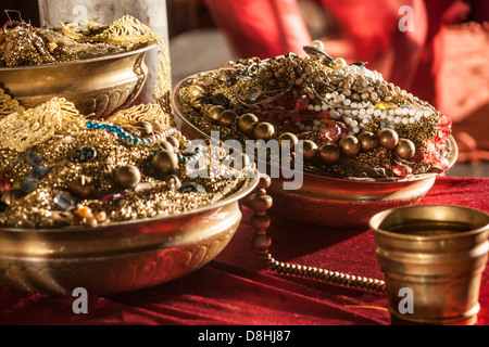Jerusalem, Israel. Gold, pearls and Jewelry in gold dishes and a cup on a table. Stock Photo