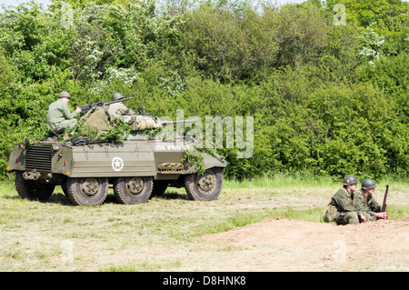 Overlord, D-Day re-enactment at Denmead 2013. American M8 Greyhound Armoured car moving into position. Stock Photo