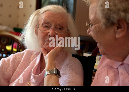 two geriatric ladies having friendly chat in a nursing home Stock Photo