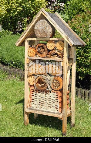 Insect hotel in a garden Stock Photo