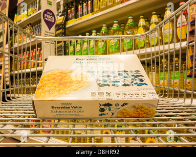 Tesco's Everyday Value own label products in shopping trolley in Tesco supermarket. England, UK Stock Photo