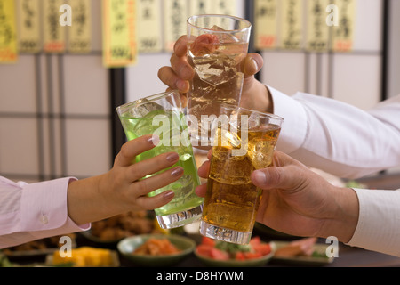 Three People Toasting with Various Chu-Hi at Izakaya Stock Photo