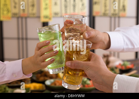 Three People Toasting with Various Chu-Hi at Izakaya Stock Photo