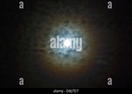 Lunar Corona with fleecy Clouds Stock Photo