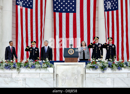 US President Barack Obama arrives to deliver a Memorial Day address at the Memorial Amphitheater at Arlington National Cemetery May 27, 2013 in Arlington , VA. Joining him: left, Gen. Martin Dempsey, chairman of the Joint Chiefs of Staff; Secretary of Defense Chuck Hagel; Kathryn Condon, the director of the Army National Cemeteries; Maj. Gen. Michael Linnington, the commanding general of the Military District of Washington; and Col. Michael Brainerd, chaplain. Stock Photo