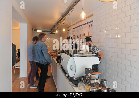 Shoreditch, London, Uk. 30th May 2013. Inside the #Guardiancoffee shop in Shoreditch. #Guardiancoffee a temporary pop-up coffee shop in Shoreditch opens for three months, with iPads on tables and an interactive screen showing tweets and coffee sales. Credit:  Matthew Chattle/Alamy Live News Stock Photo