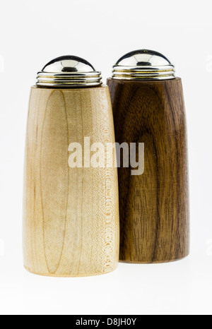 Wooden salt and pepper shakers on a white background. Stock Photo