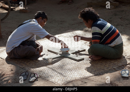 Unusual board game being played in the street, Mandalay Myanmar 2 Stock Photo