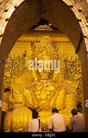 Gold leaf-encrusted Buddha in the Mahamuni Pagoda in Mandalay, Myanmar 2 Stock Photo