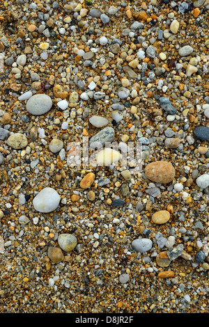 Pebbles and small stones worn smooth by the waves and tides, Kerhostin beach (Other name : Pouladen beach), Stock Photo