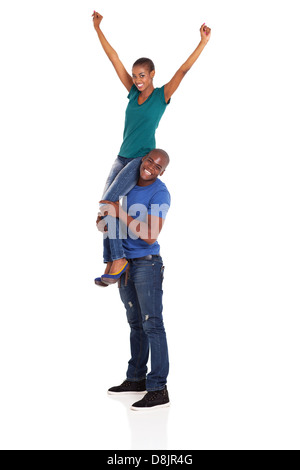 happy african woman sitting on her boyfriend's shoulder isolated on white Stock Photo