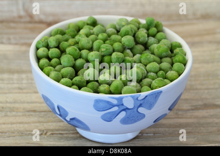 Bowl of frozen green peas Stock Photo