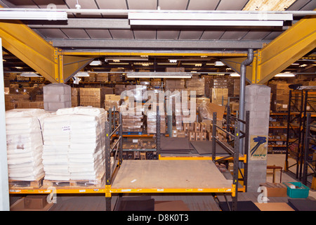overview of cardboard boxes piled high at Charles Birch Ltd Warehouse shoe repair supplies, Leeds Stock Photo