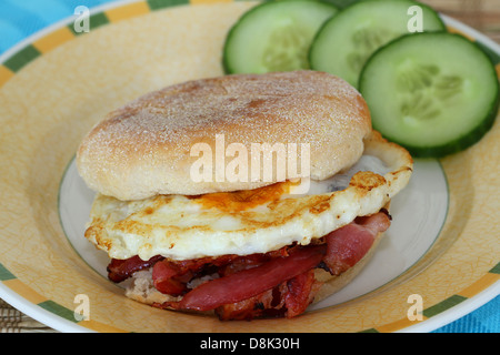 English muffin with fried egg and bacon Stock Photo