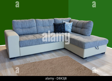 L shape fabric four sitter sofa, grey color Stock Photo