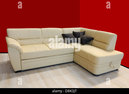 L shape fabric four sitter sofa, yellow color Stock Photo