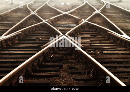 Railway in fog on station Stock Photo