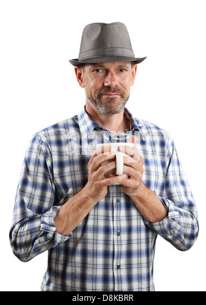 A brightly lit portrait of a 40-something male with a soft smile wearing a fedora and holding a cup of coffee, isolated on white Stock Photo