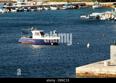 Small motorboat on the blue sea Stock Photo