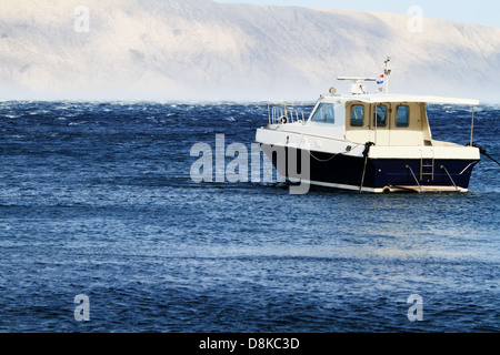 Small motorboat on the blue sea Stock Photo