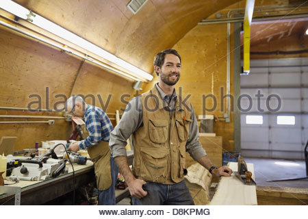 Carpenter working on project in workshop