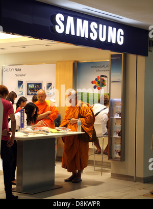 Thai Buddhist monks shopping inside Samsung store in Bangkok , Thailand Stock Photo