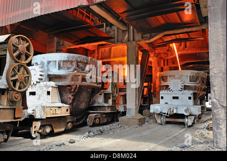 steel buckets to transport the molten metal inside of plant Stock Photo