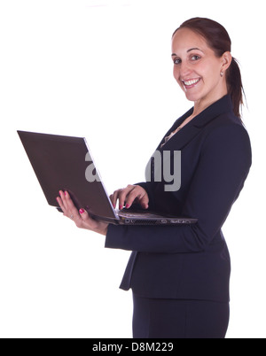 Smiling business woman working on a laptop computer Stock Photo