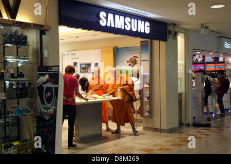 Thai Buddhist monks shopping inside Samsung store in Bangkok , Thailand Stock Photo