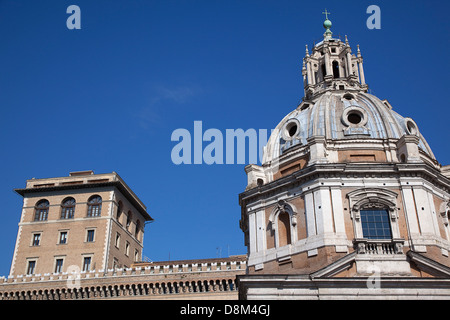 Italy, Lazio, Rome, Exterior of the Palazzo di Venezia museum with church dome in the foreground. Stock Photo