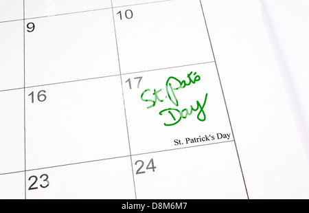 A calendar page showing 17th March, Saint Patrick's day.  St. Pat's Day written in green ink Stock Photo