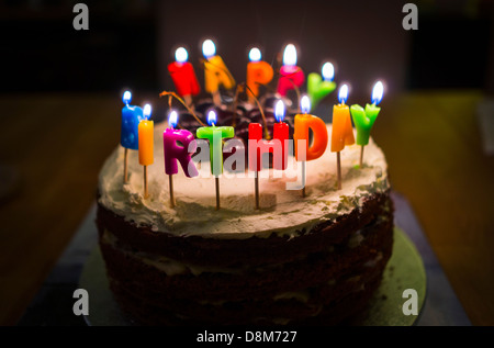 Birthday cake with happy birthday candles Stock Photo