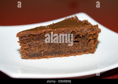 Home made moist chocolate cake on white plate Stock Photo