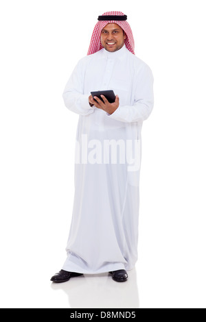 full length portrait of middle eastern man using tablet computer on white background Stock Photo