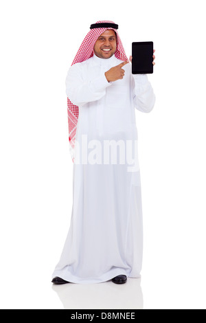smiling middle eastern man pointing at tablet computer isolated on white Stock Photo