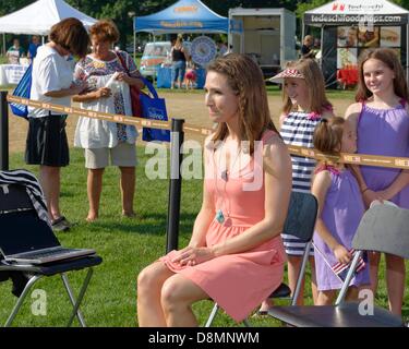 Concord, Massachusetts, USA. 31st May 2013. Shiri Spear Fox25 meteorologist jokes with production team in between shots during the Fox 25 Boston Zip Trip. Credit:  Mark Nassal/Alamy Live News Stock Photo