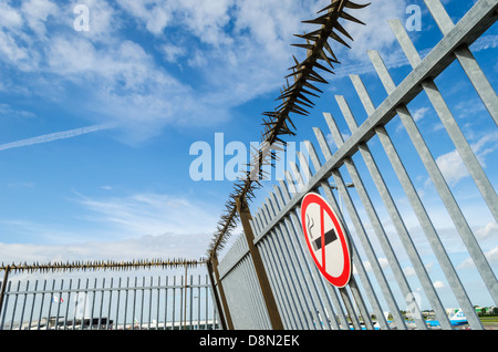 No Smoking sign and a security fence at Amsterdam Airport Schiphol. Amsterdam, NL. Stock Photo