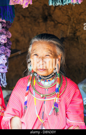 Karen Padong tribeswoman in a village near Chiang Rai, northern Thailand, an elderly Burmese refugee from Myanmar Stock Photo
