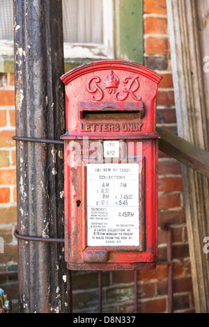 Vintage King George VI GR red post box attached to a lamppost Stock Photo