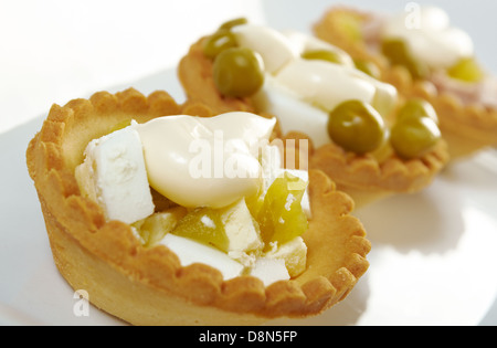 tartlet with salad on a white plate Stock Photo