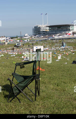 Epsom, Surrey, UK. 2nd June, 2013. The clear up after Derby Day. An old abandoned chair left by a race  day fan.  Litter and rubbish sacks can be seen everywhere after the Derby crowds have left. A massive clear up operation will be put into place to get the spectator area back to normal. Credit:  Colin Hutchings/Alamy Live News Stock Photo