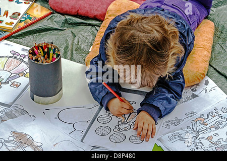 Child colored on the default drawings forms. Stock Photo