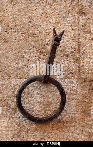 Old ring for tethering horses, San Quirico d'Orcia, Italy. Stock Photo