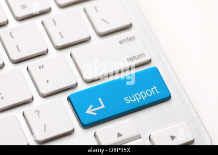 A computers support key on white keyboard Stock Photo