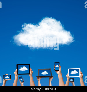 cloud computing concept. hands holding computer laptop smart phone tablet and touch pad Stock Photo