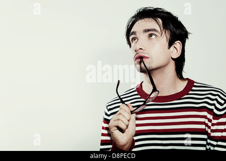 Portrait of a young man with a dreamy look closeup Stock Photo