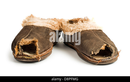 Old torn boots of leather with a hole. Stock Photo