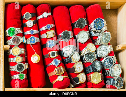 Old clocks on a shelf in shop Stock Photo